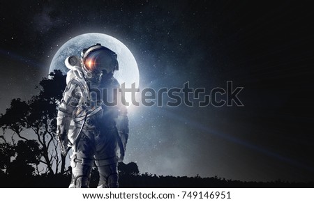 Spaceman in astronaut suit. Mixed media
