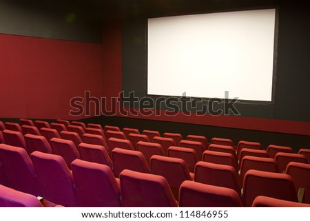 cinema and red seats rows empty screen