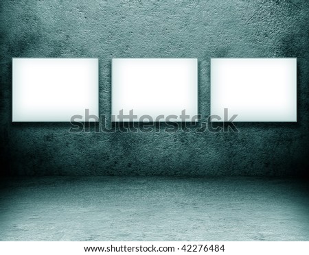a blank white screen. stock photo : grungy blue room. with three lank white screen board