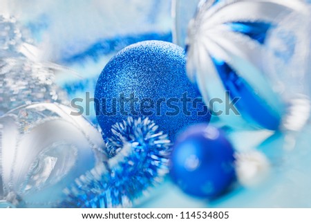 New Year decorations ball on blue blurred background