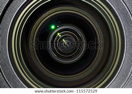 Photographic lens closeup view with light reflections