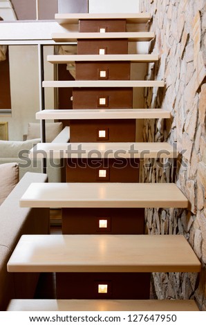 Modern style staircase and ashlar wall, interior detail