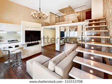 Modern minimalism style two-high drawing-room interior with staircase in beige tones