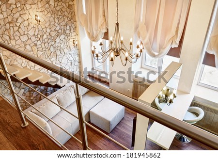 Modern art nouveau style two-high living-room interior with staircase, top view