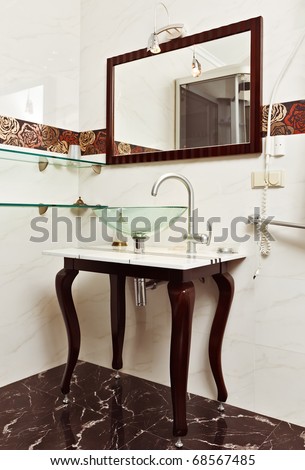 Modern bathroom interior with Glass sink bowl and mirror