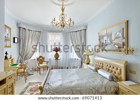 Classic style luxury bedroom interior in blue colors with boudoir and window