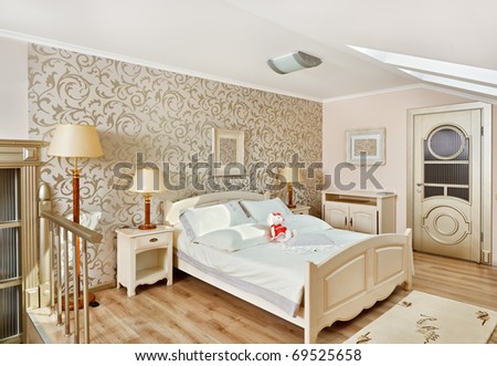 Modern art deco style bedroom interior in light beige colors on loft room