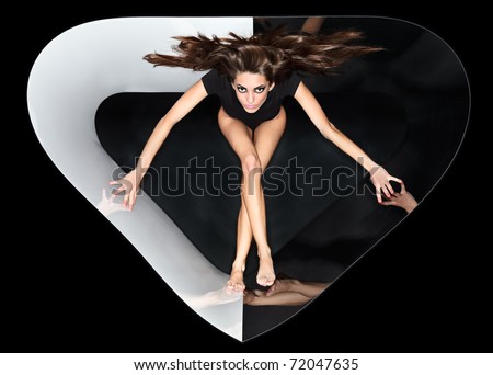Young slim beautiful lady with long hairs running in abstract plastic tube, ring flash fashion portrait