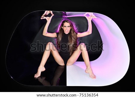 Young slim beautiful lady with long hairs in abstract plastic tube, ring flash fashion portrait