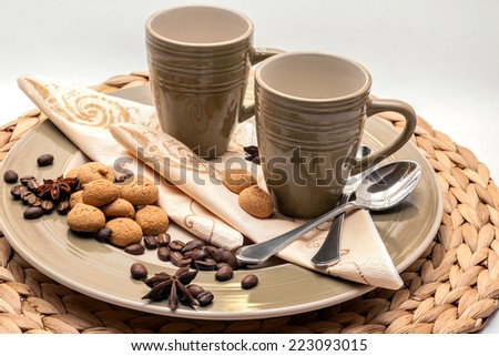 2 espresso cups with plate, pastry and decoration in natural tones