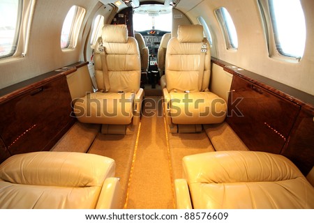 Front view of the small private jet cabin