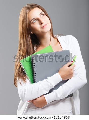 Casual dressed high school student girl smiling