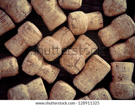 Dated wine bottle corks on the wooden background. Close up
