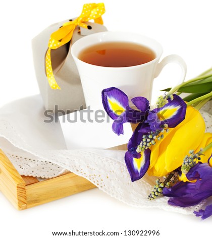 Tea with flowers and gift box for mom in Mother's Day