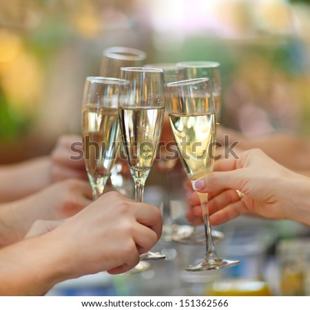 http://image.shutterstock.com/display_pic_with_logo/461851/151362566/stock-photo-celebration-people-holding-glasses-of-champagne-making-a-toast-151362566.jpg