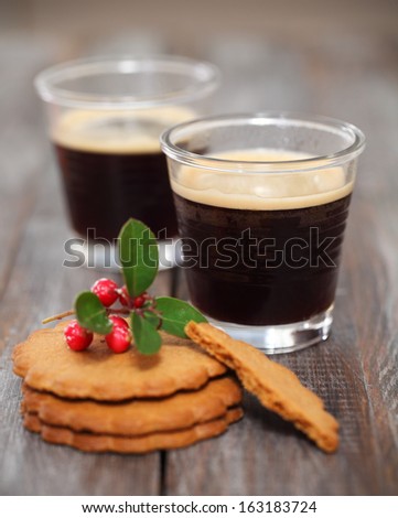 Christmas cookies with hot coffee and Christmas decorations on the wooden background