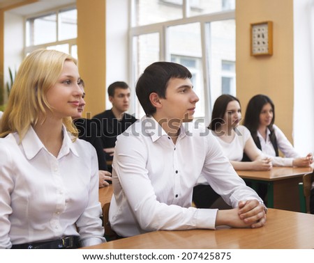 Students in class room listening to the teacher