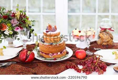 Dessert table servi?ed for a wedding. Cake, cupcakes, sweetness and flowers