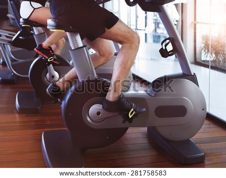 Healthy couple training on a treadmill in a sport centre