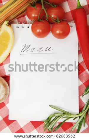 Vegetables still life with menu blank on checkered background