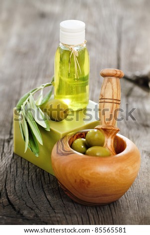 Organic cosmetics from olive oil on the wooden background