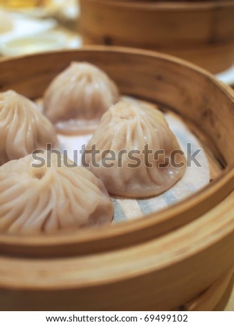 Chinese style meat dumplings in steamer