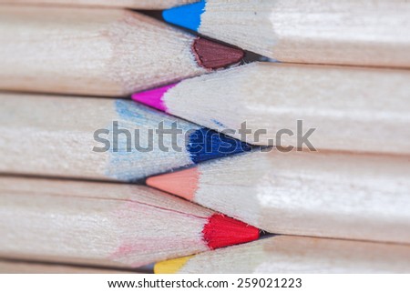 Colored pencils. Very shallow depth of field. Focus on blue pencil leads