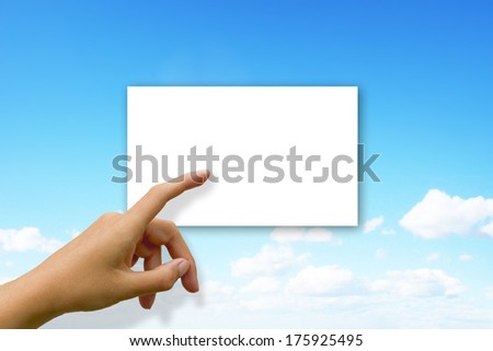 Woman touching white card on clouds background