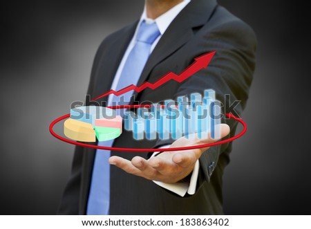 Businessman using a 3D chart during a meeting
