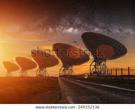 Radio Telescope view at night with milky way in the sky