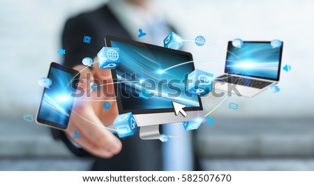 Businessman connecting tech devices and icons applications with each other 3D rendering