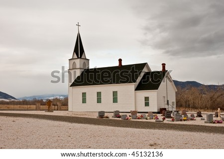 a small country church and cemetery in the  mountains of Montana