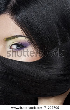 Beauty Young Brunette Woman on blue background Beauty face woman with make-up