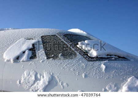 Jet covered in morning snow