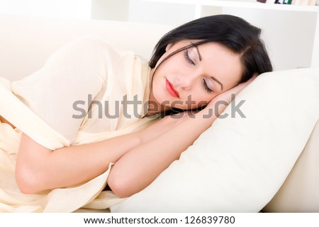 young beautiful woman sleeping on the couch