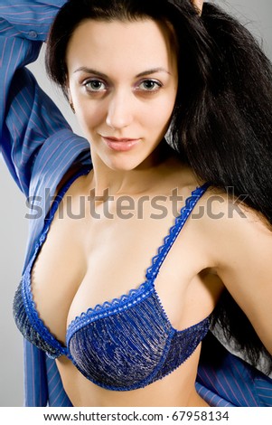 stock photo The young girl in dark blue linen with the big breast