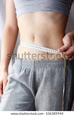 Woman measuring her waistline. Perfect Slim Body. Diet - Stock Image -  Everypixel