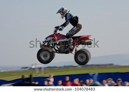 GALWAY, IRELAND - MAY 26:  Unidentified quadrocycle rider jumps through the air during The  Extreme Stunt Show on May 26, 2012 in Galway, Ireland