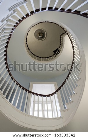 Spiral stairs with railings and window in Dublin Castle.