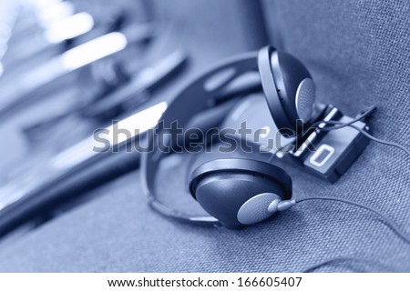 wireless multi language headphones set on the chairs in conference room. Monochromatic