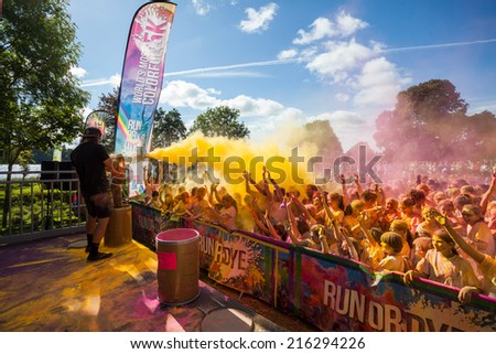 LOUGH CUTRA, GORT, IRELAND - SEPTEMBER 6: Unidentified people having fun get showered in powdered dye during annual RUN OR DYE, the 5K event, on September 6, 2014 in Lough Cutra, Gort, Ireland.