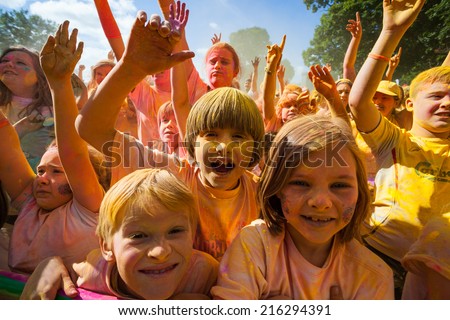 LOUGH CUTRA, GORT, IRELAND - SEPTEMBER 6: Unidentified people having fun get showered in powdered dye during annual RUN OR DYE, the 5K event, on September 6, 2014 in Lough Cutra, Gort, Ireland.