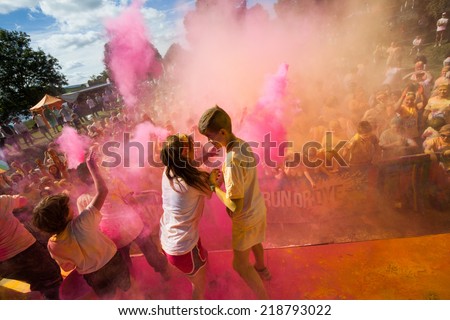 LOUGH CUTRA, GORT, IRELAND - SEPTEMBER 6: Unidentified people having fun and get showered in powdered dye during  annual RUN OR DYE, the 5K event, on September 6, 2014 in Lough Cutra, Gort, Ireland.