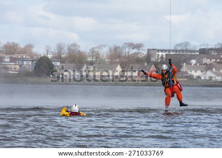 GALWAY, IRELAND - APRIL 12: Irish Coast Guard crew display a water rescue training over Lough Atalia as part of the annual Galway Watersports Show, on April 12, 2015 in Galway, Ireland.