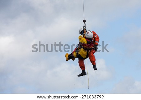 GALWAY, IRELAND - APRIL 12: Irish Coast Guard crew display a water rescue training over Lough Atalia as part of the annual Galway Watersports Show, on April 12, 2015 in Galway, Ireland.