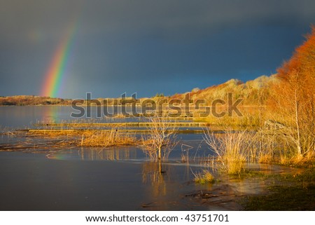 Rose Lake covered by ice and rainbow,Connemara,Ireland