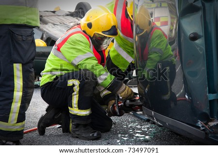 Fire and Rescue Emergency Units at car accident with Power Wedge