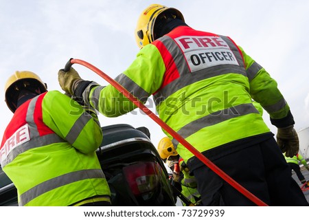 Fire and Rescue Emergency Units at car accident with Power Wedge