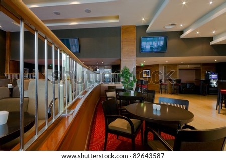 Hotel bar-restaurant interior with chairs and tables