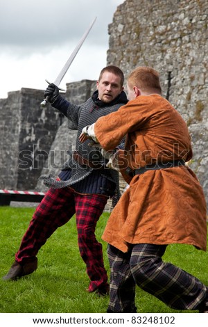 ATHENRY, IRELAND - AUGUST 21: Lucas and John from Eireann Edge display medieval combat at annual National Walled Towns Day  on August 21, 2011 in Athenry, Ireland.